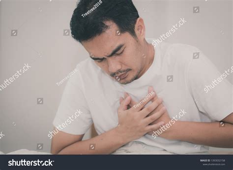 Asian Man Has Chest Pain While Stock Photo 1393032158 | Shutterstock