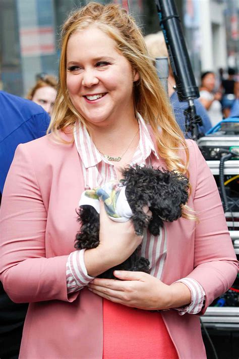 Amy Schumer Poses Nearly Nude While Holding a Hot Dog Dog