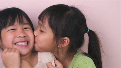 Sisters Kissing Stock Video Footage for Free Download