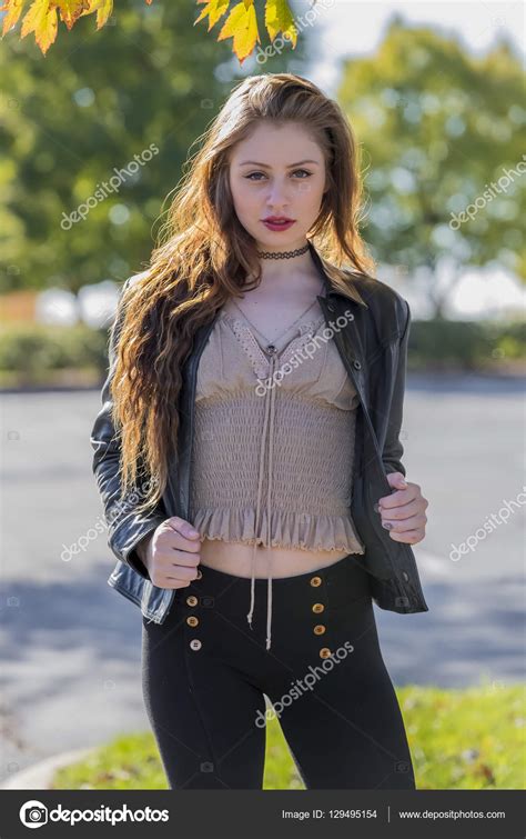 Sexy Brunette Coed Enjoying The Fall Foliage Stock Photo by ©actionsports 129495154
