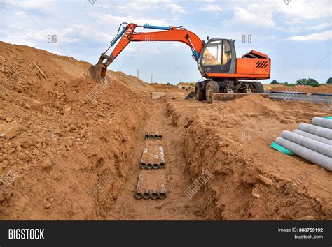 Excavator Dig Trenches Image & Photo (Free Trial) | Bigstock