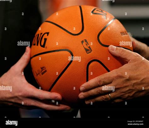 A side view of the new official NBA game basketball is displayed at the ...