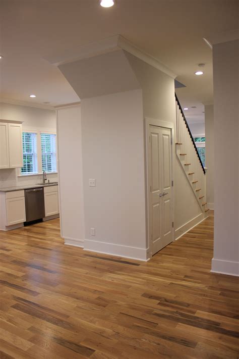 Pickled white oak floors open concept, white shaker cabinets. | White ...
