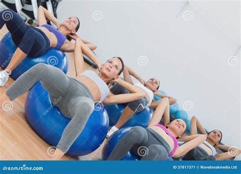 Class Doing Abdominal Crunches on Fitness Balls Stock Image - Image of ...