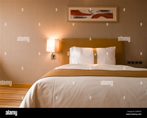 bed in a hotel room Stock Photo - Alamy