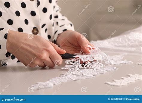 Dressmaker Cutting Beautiful White Lace at Table in Atelier, Closeup ...