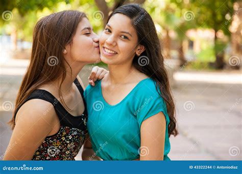 Kissing my best friend stock photo. Image of friends - 43322244