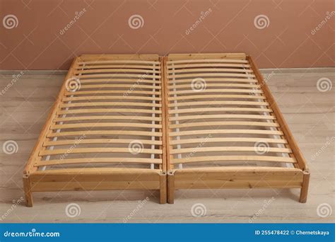 Wooden Bed Frame on Floor in Room Stock Photo - Image of empty, relax ...