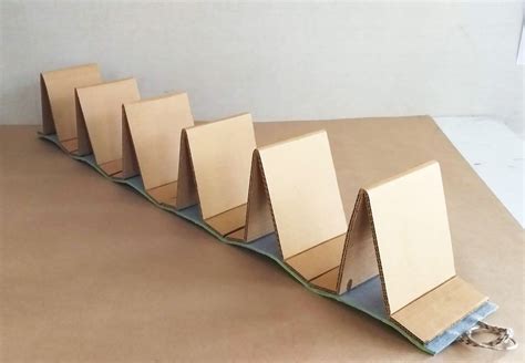 Cardboard Book Stand | Cardboard display stand, Diy book stand, Book ...