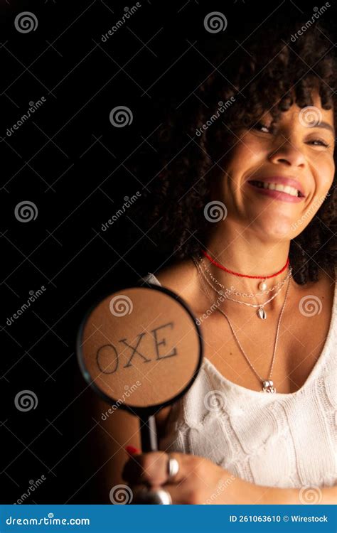 Portrait of a Woman Holding a Magnifying Glass Against Written Word Oxe ...