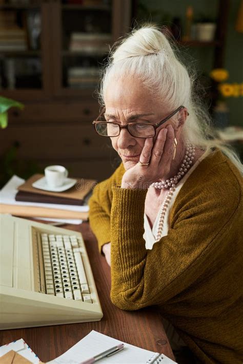 See related image detail. Elderly Woman Contemplating while Sitting at Desk Stock Image - Image ...