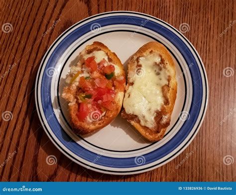 Molletes Made of Sliced Bolillo Bread with Grilled Cheese and Beans ...