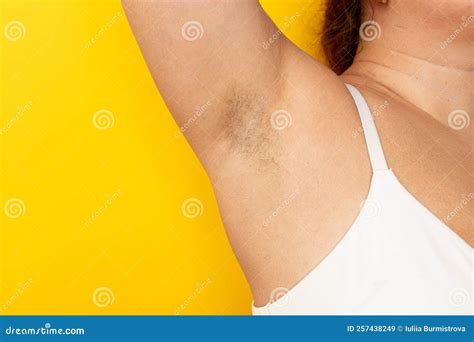 Woman Touch Hairy Underarms with Hand Closeup, Free Copy Space, Yellow ...