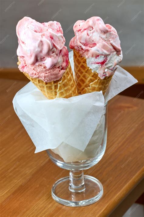 Premium Photo | Ice cream in cones on restaurant table