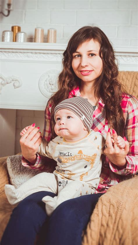 Download Mother and Toddler Enjoying Quality Time Together Wallpaper ...