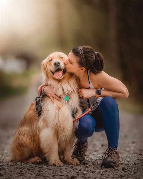 Download Golden Retriever Dog And Girl Kissing Wallpaper | Wallpapers.com