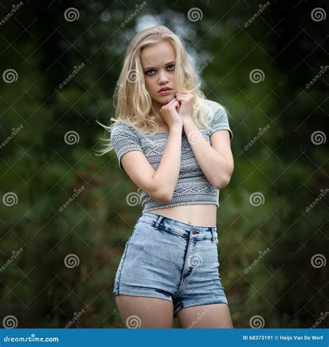 Bautiful Blond Teenage Girl Alone in the Woods Stock Image - Image of fashion, outside: 68373191