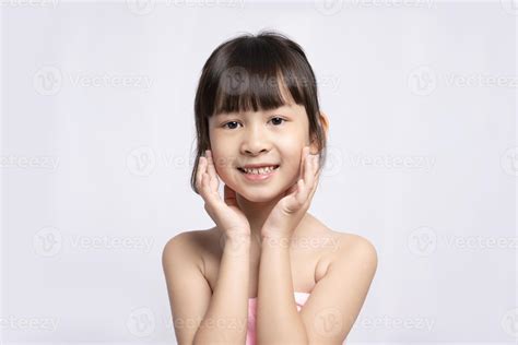 Asian girl, bright face on white background, Skin care beauty treatments concept. White model ...