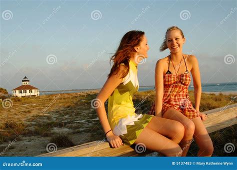 Teen girls at beach stock image. Image of relaxed, sitting - 5137483