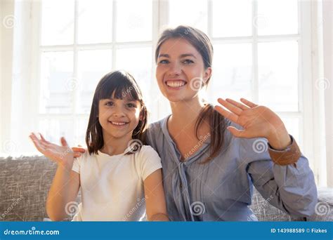 Happy Mother and Daughter Looking at Webcam and Wave Hands Stock Image ...