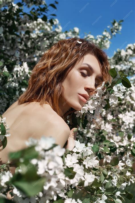 Premium Photo | Beautiful nude art woman in branches and foliage of a ...