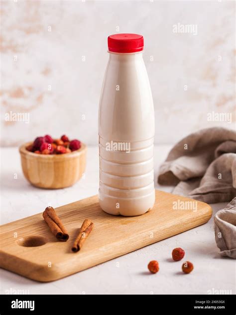 Farm-style ryazhenka in a bottle with cinnamon, a traditional fermented ...