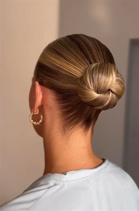 Slicked Back Midi Bun, no face framing (Probable Middle Part?) in 2025 ...