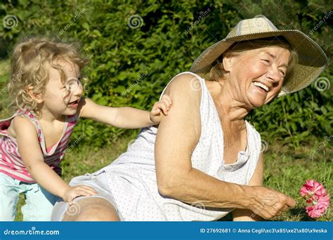 Grandma and Granddaughter Play in Garden Stock Image - Image of female ...