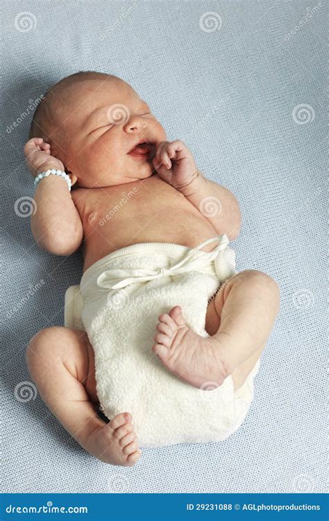 Happy Gurgling Baby Lying On His Bed Royalty-Free Stock Photo ...