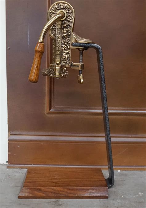 Lot - Vintner Brass and Iron Wine Bottle Opener, H: 24 in. (61 cm.)