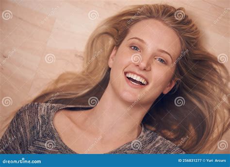 Lying Down with Laughter. a Young Woman Lying on Her Back on the Floor ...