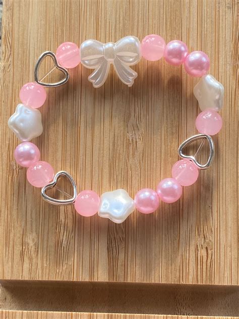 Pink Bow Bracelet - Etsy | Girly bracelets, Beaded bracelets diy, Cute ...