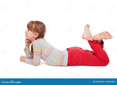 Smiling Child Girl Lying on Stomach on the Floor Stock Image - Image of ...