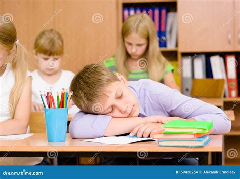 Boy Sleeping In Classroom Stock Photo | CartoonDealer.com #20426070