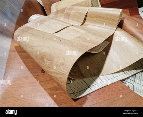 A pile of remnants of pieces of linoleum stacked on top of each other ...