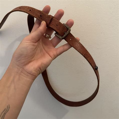 Skinny Brown Belt - some fraying and worn leather... - Depop