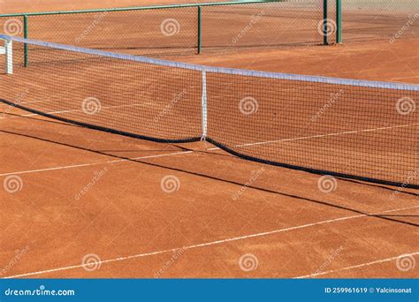 Baseline and Net of an Empty Clay Tennis Court on a Sunny Day Stock ...