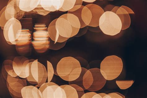 Download Aesthetic Light Brown Bokeh Lights Wallpaper | Wallpapers.com