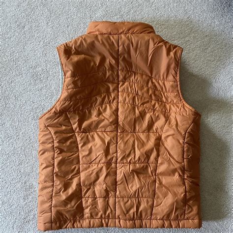 Vintage style orange puffer vest. It looks a lil... - Depop
