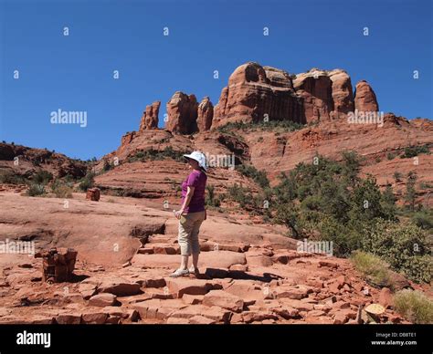 Woman tourist hikes at Cathedral Rock, a magnetic (feminine) energy ...