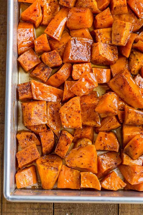 Candied Yams made with sweet potatoes, brown sugar, cinnamon, and mini marshmallows are the ...