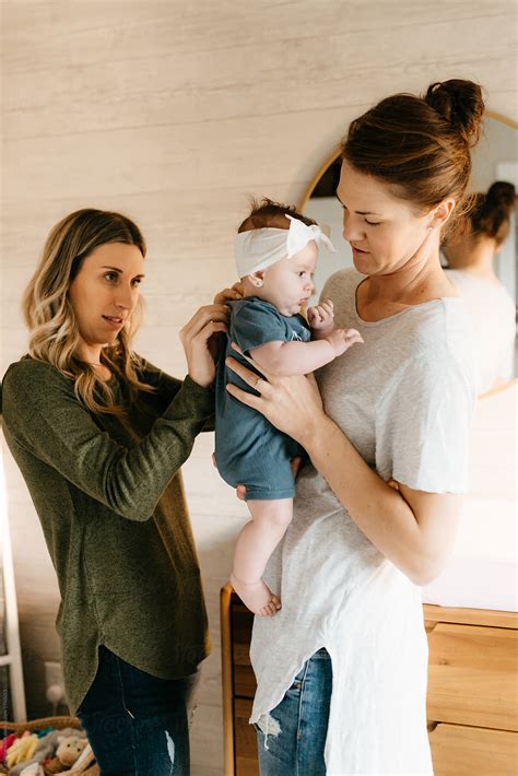 "Two Lesbian Moms In Babies Nursery Together." by Stocksy Contributor ...