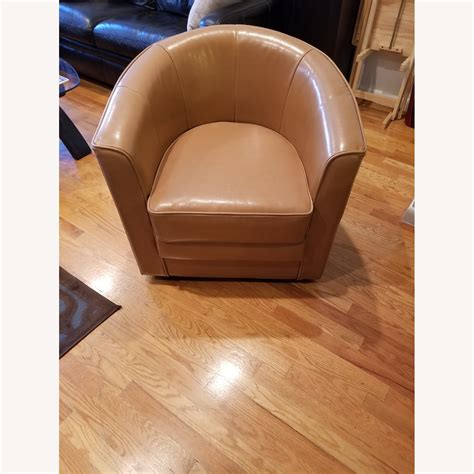 Brown Leather Swivel Barrel Chair at Toby Skene blog