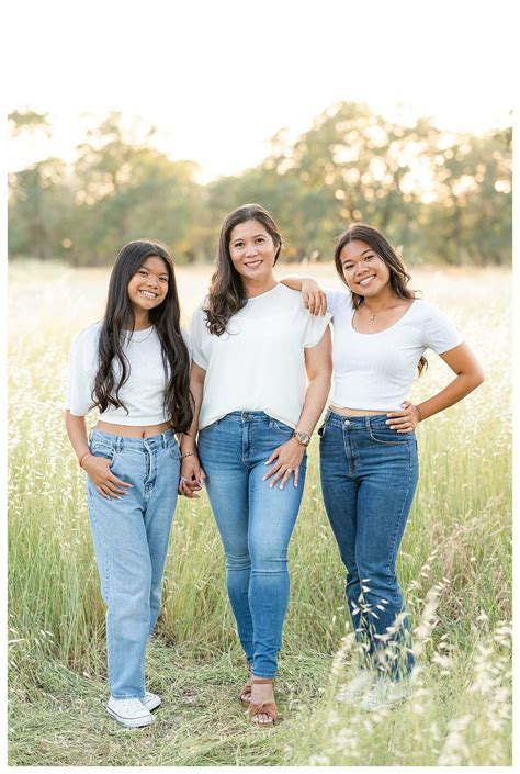 Mom and daughters posing idea during outdoor family photo session ...