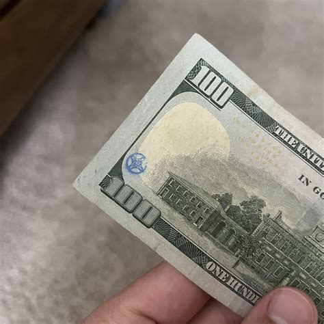 What is this symbol that looks stamped on a 100 dollar bill : r/Symbology