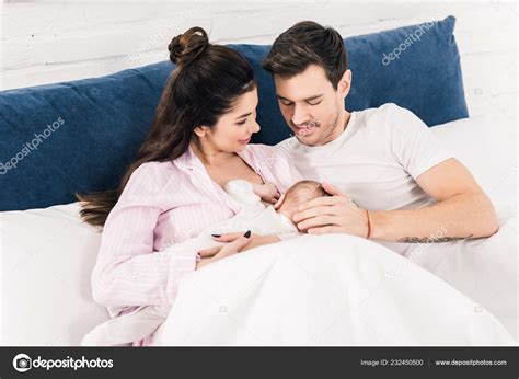 Woman Breastfeeding Husband