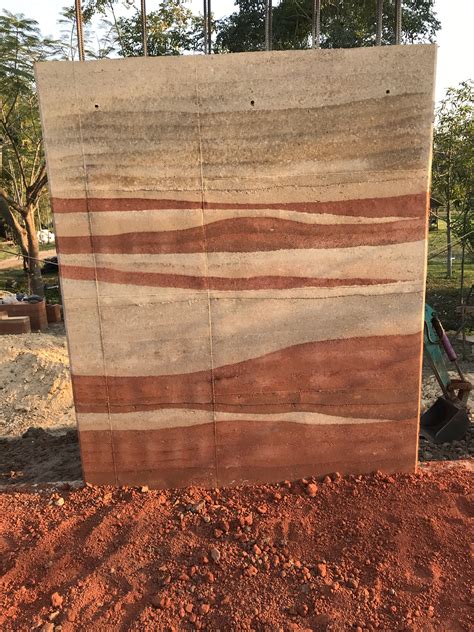 Rammed earth wall construction