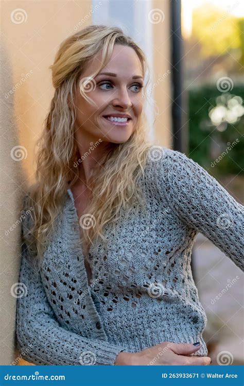 Lovely Blonde Mature Model Posing Outdoors in an Urban Environment ...