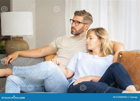 Husband and Wife Relaxing Together on Couch at Home Stock Photo - Image of relaxing, napping ...