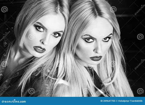 Young Pretty Girls, Twin Sisters with Blond Hair. Fashionable Makeup ...
